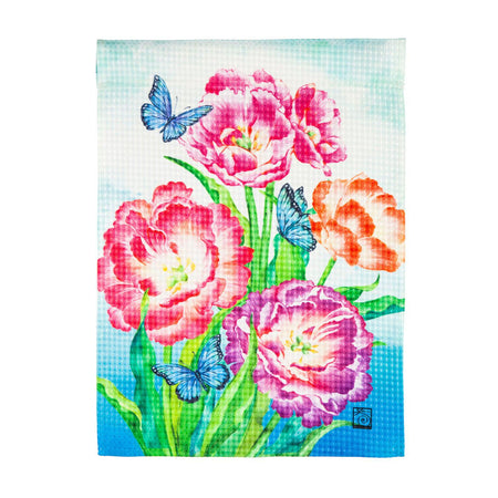 The Blooming Tulips garden flag features blue butterflies among vividly colored tulips in full bloom.