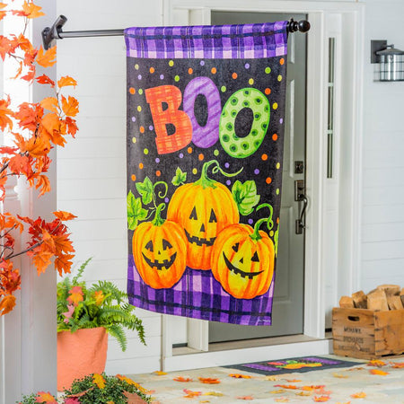 The Boo Jack-O-Lanterns house banner features a trio of smiling jack-o-lanterns over a purple and black checked and dotted background, and the word "BOO". 