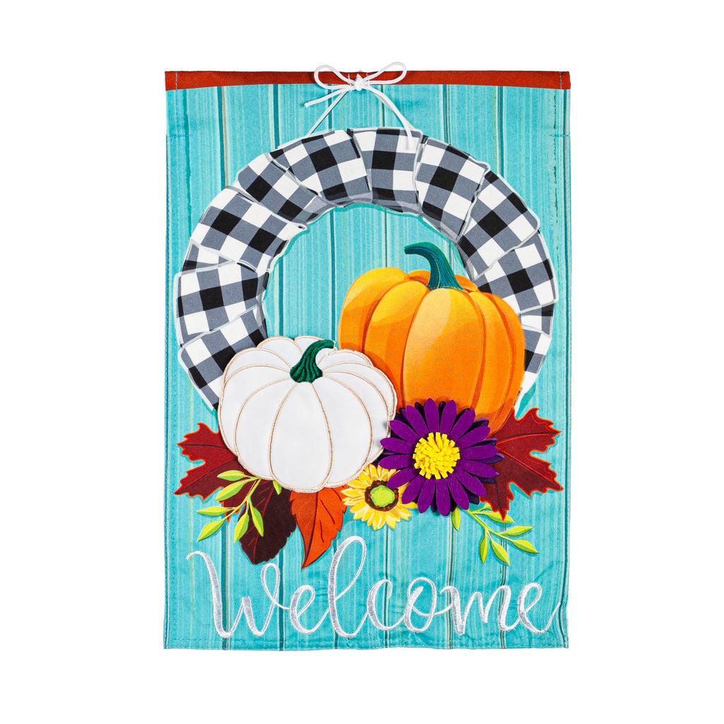 Our Buffalo Check Fall Wreath garden flag features a black and white checked wreath decorated with pumpkin and flowers and the word "Welcome". 