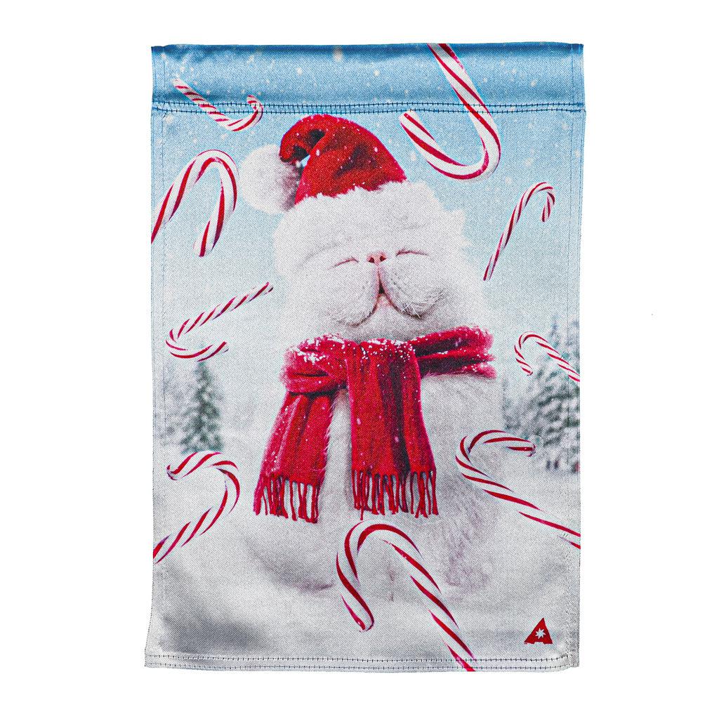 The Fluffy Cat Snowman garden flag features a fluffy white cat, wearing a red scarf and Santa hat, with candy canes floating around him.