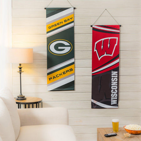 Show your pride for the Green Bay Packers with the two-sided dowel banner.  Constructed of durable suede fabric and suitable for both indoor and outdoor use. Comes ready to hang with a sturdy dowel and string.