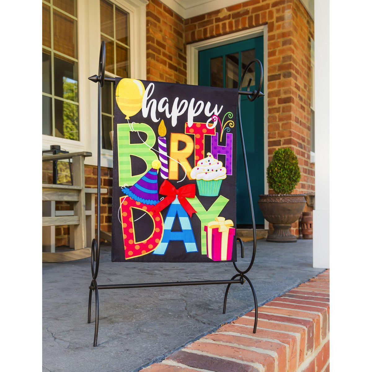 The two-sided Happy Birthday garden flag features a balloon, cupcake, candle, bow, presents, and the words "Happy Birthday"!