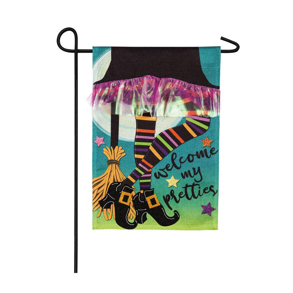 The My Pretties garden flag features a witch's skirt, striped legs and broom and the words "Welcome My Pretties". 