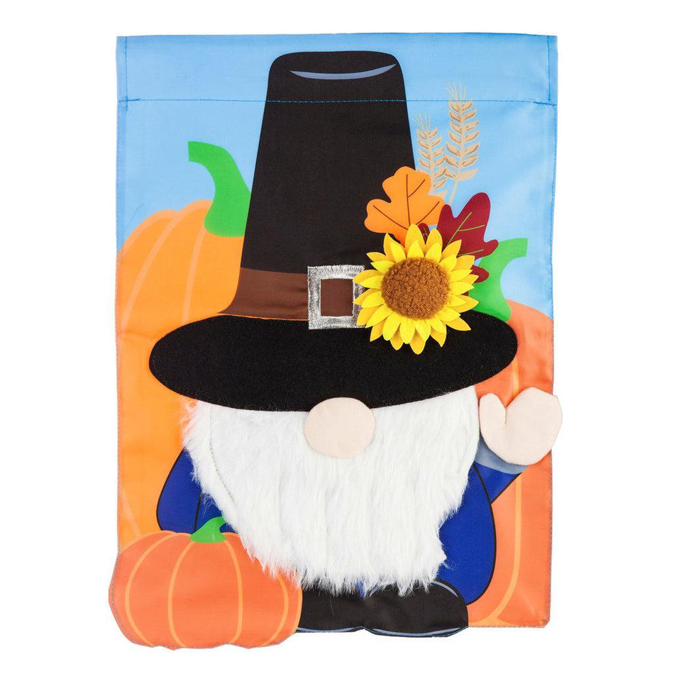 The Pilgrim Gnome garden flag features a waving gnome wearing a pilgrim hat and surrounded by pumpkins.