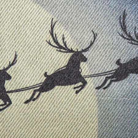 The Santa's Sleigh on Christmas garden flag features Santa and his reindeer flying over a small village with a beautiful Christmas tree, and the words "Merry Christmas" across the top. 