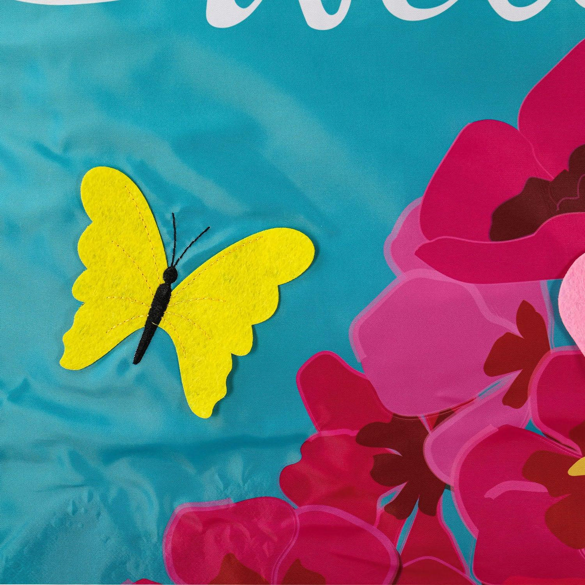 The Spring Geraniums house banner features vivid pink geraniums with hot pink checked top and bottom borders and the word "Welcome" across the top. 