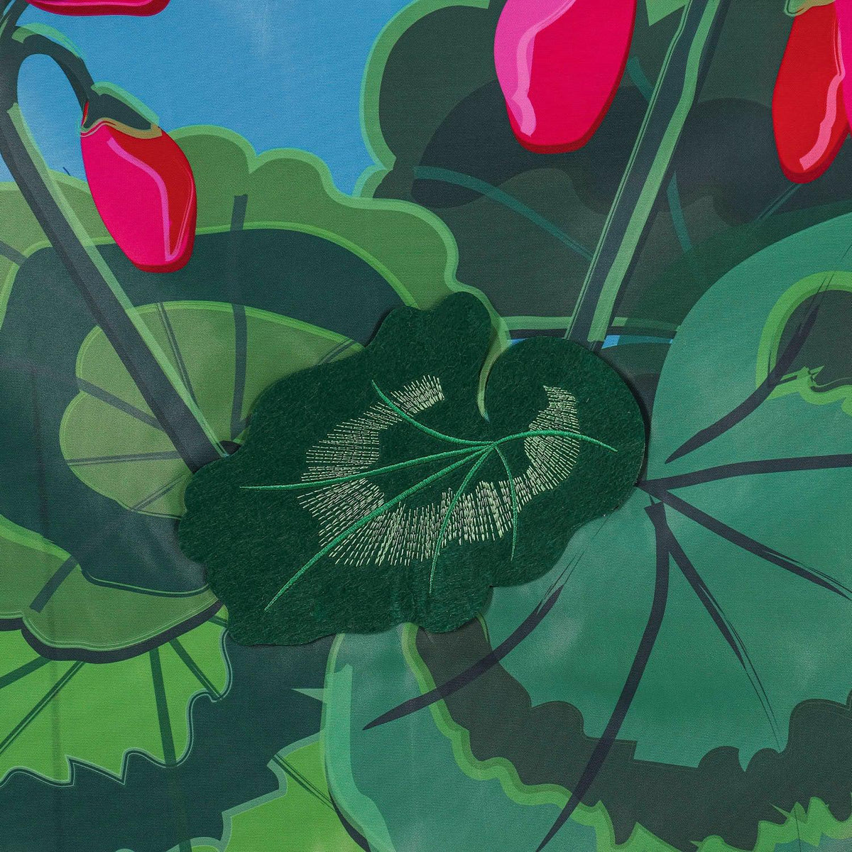 The Spring Geraniums house banner features vivid pink geraniums with hot pink checked top and bottom borders and the word "Welcome" across the top. 