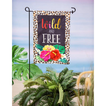 The Wild and Free garden flag features bright flowers, a black background, a border of leopard spots, and the words "Wild and Free".